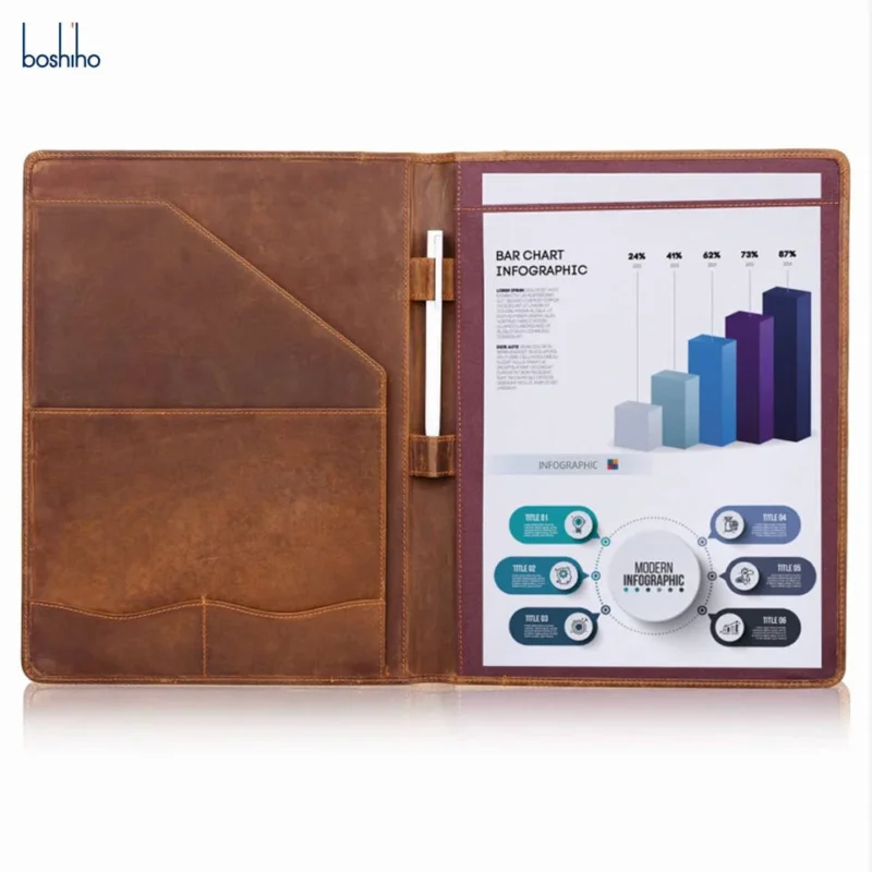 Open brown leather padfolio with document pockets and writing pad