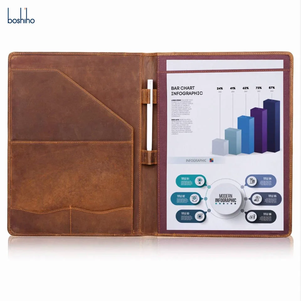 Open brown leather padfolio with document pockets and writing pad