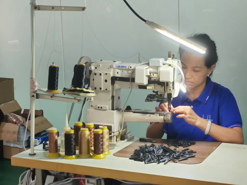 BOSHIHO production specialist working at a sewing station
