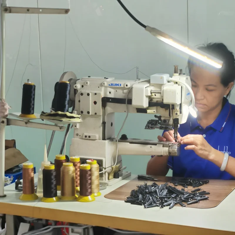 BOSHIHO production specialist working at a sewing station
