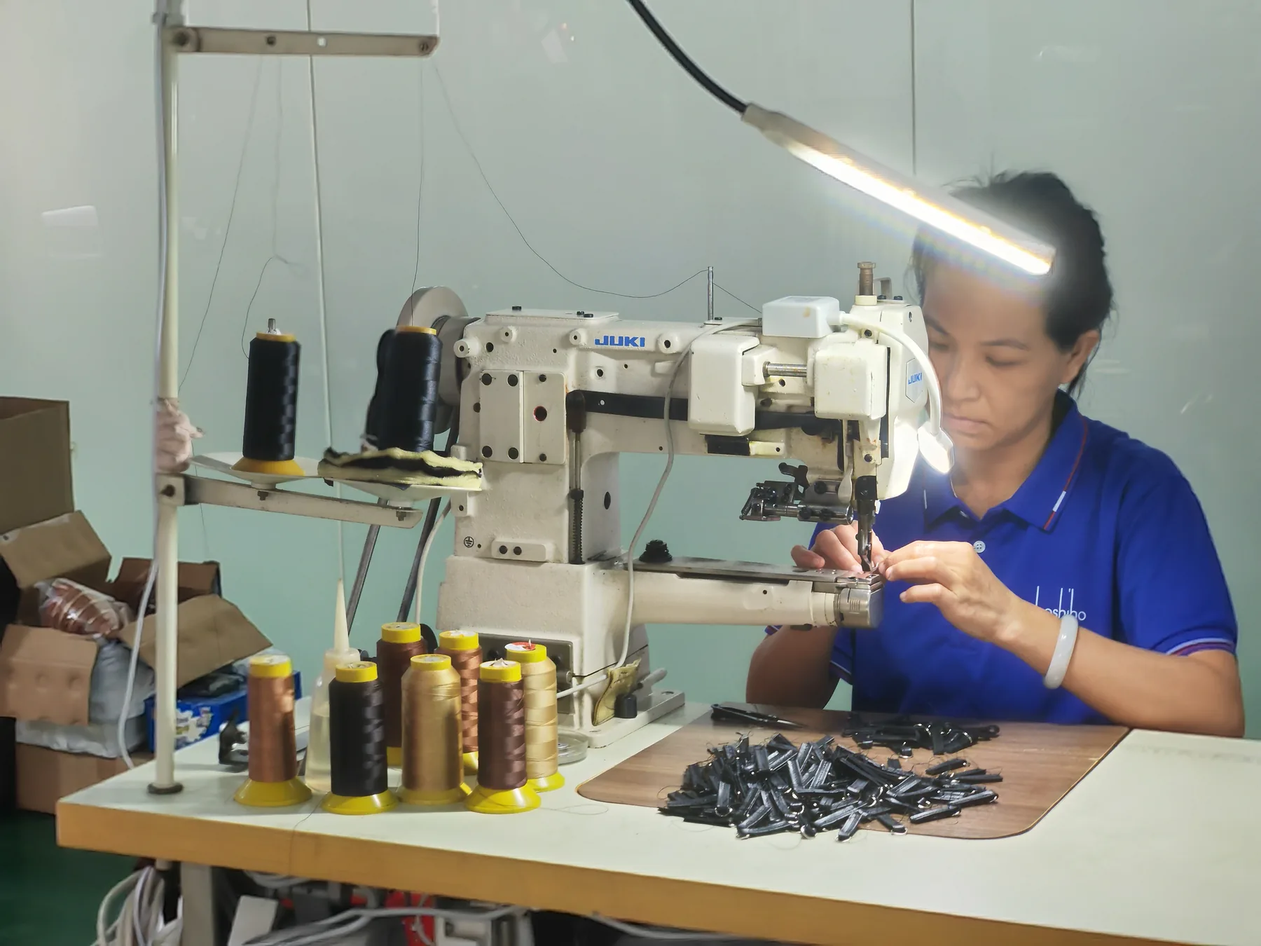BOSHIHO production specialist working at a sewing station