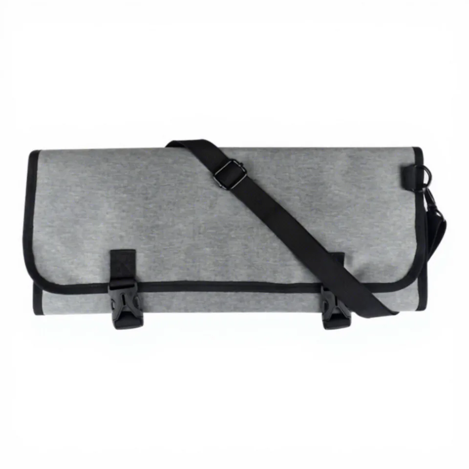 Folded grey chef tool bag with external securing straps