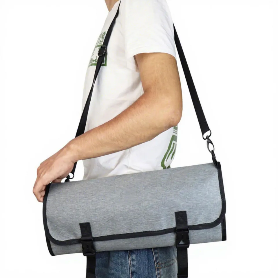Folded chef tool bag carried with a shoulder strap