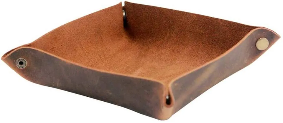 Empty brown leather bedside tray with snap-up corners