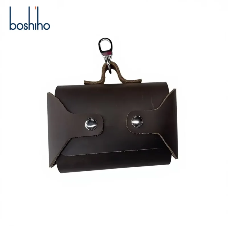 Leather waste-bag holder showing snap-fastened panels and clip