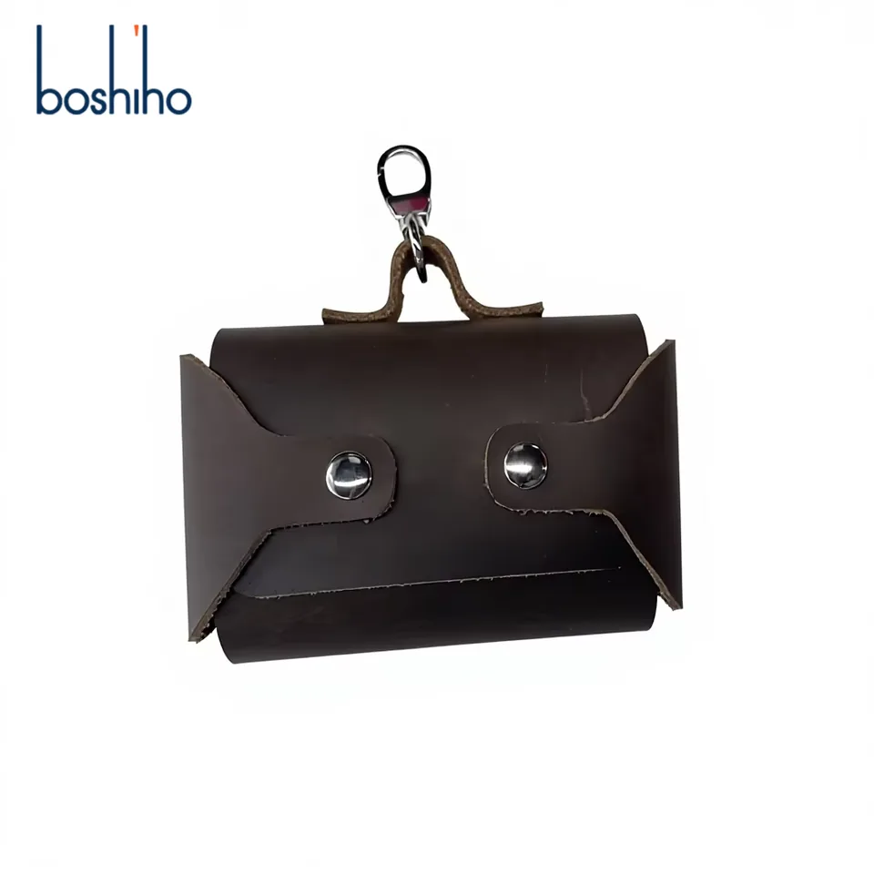 Leather waste-bag holder showing snap-fastened panels and clip