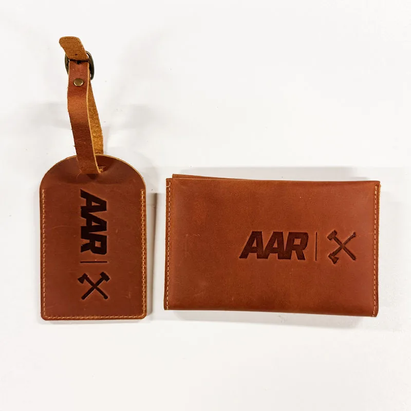 Brown leather passport cover and matching luggage tag with custom logo