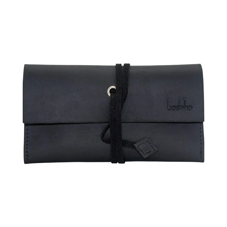 Closed empty black leather pouch with wraparound cord