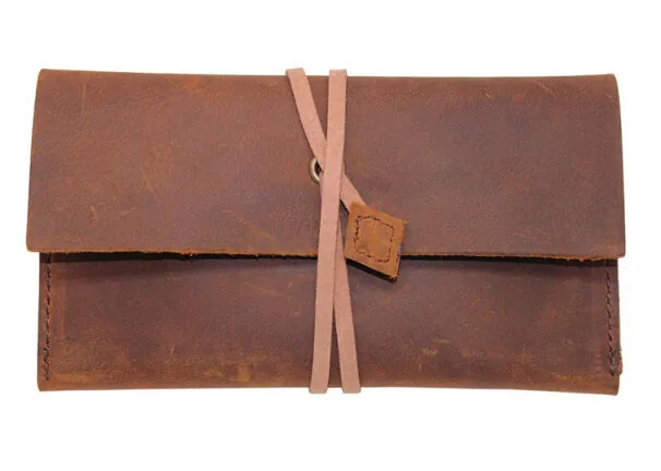 Closed empty brown leather pouch with wraparound tie