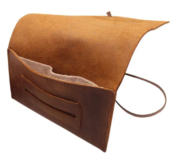 Empty leather pouch with main pocket opened