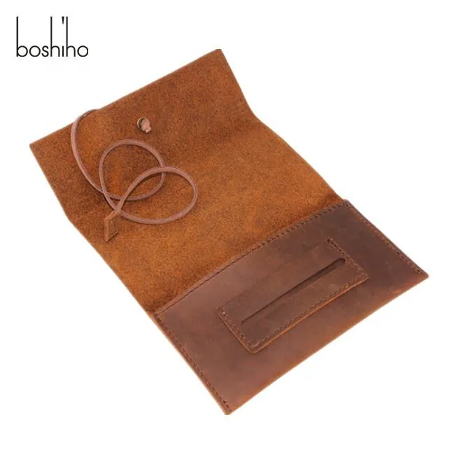 Open empty leather pouch showing flap and interior slot