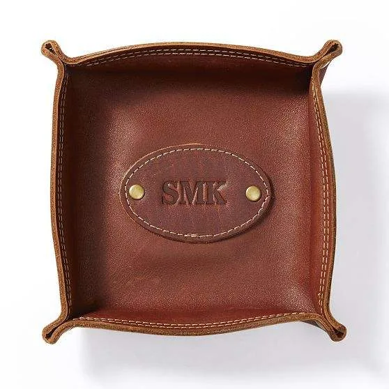 Top view of a brown square PU valet tray with personalized panel