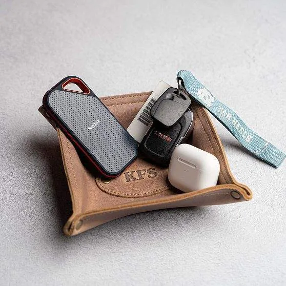 Snap-corner valet tray holding keys and small daily items